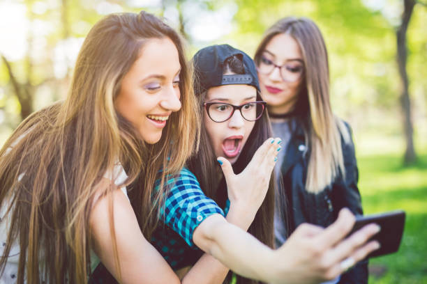 istock Hipster girls taking selfies 1011323352