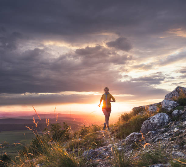 istock Woman athlete running in nature 1011327294