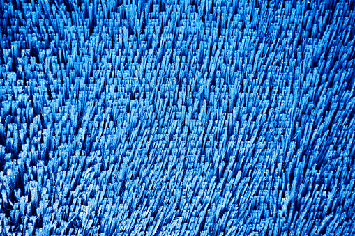 Background of a carpet covering of textiles in close-up of blue color.