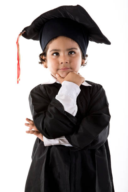 istock Thoughtful girl in graduation gown 1011328038