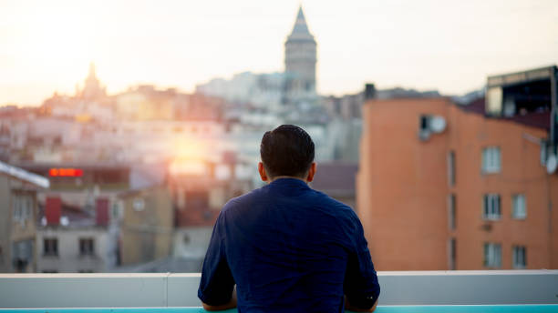 istock The man watching the Galata tower 1011344170