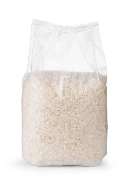 Rice in transparent plastic bag isolated on white background.