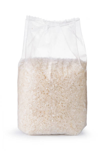 rice in transparent plastic bag isolated on white background - airtight food box package imagens e fotografias de stock