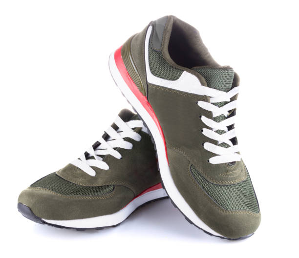 Running dark green shoes isolated on white background