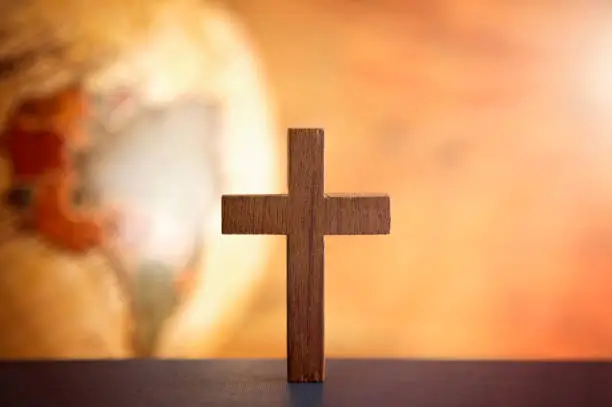 Photo of The Cross of Christ and an Antique Globe