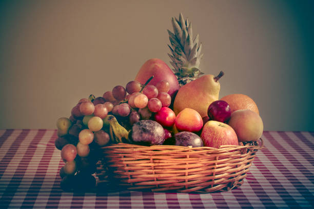 Basket of fruit in sepia color stock photo
