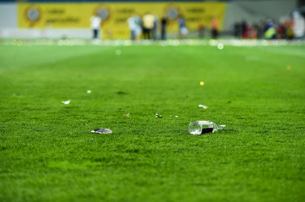 istock Plastic trash can on the turf on a soccer field 1011375160