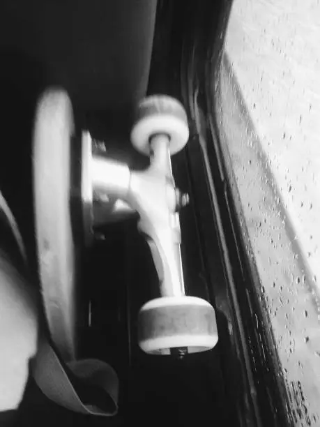 Skate wheels inside a bus on a rainy day