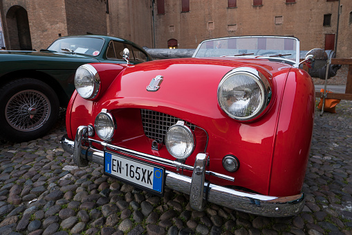 Ferrara / Italy - March 24, 2017: A red sports car Triumph during a meeting of historic cars named “Valli e Nebbie”.