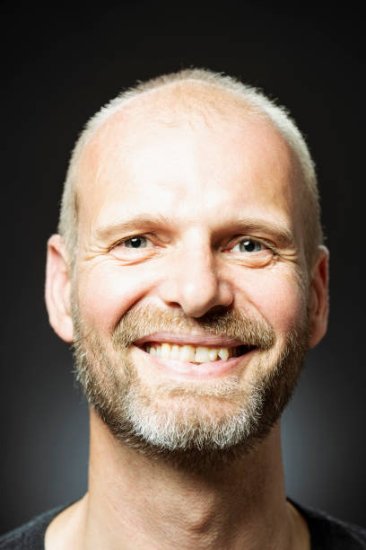 istock Happy middle-aged Caucasian male smiling at camera 1011396816