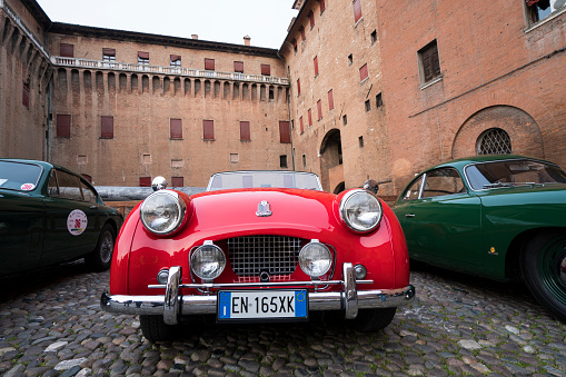 Ferrara / Italy - March 24, 2017: A classic car, a red Triumph during a meeting of historic cars named “Valli e Nebbie”.