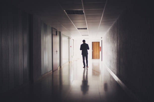 istock Businessman walking in a hallway 1011403994
