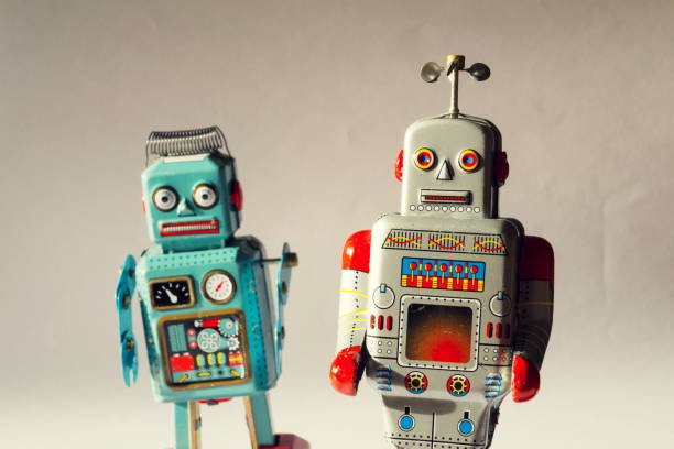 istock Two vintage tin toy robots, robotic delivery, artificial intelligence concept 1011407942