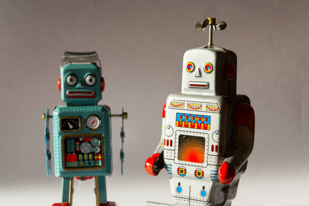 istock Two vintage tin toy robots, robotic delivery, artificial intelligence concept 1011407992