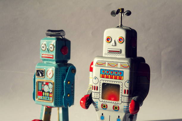 istock Two vintage tin toy robots, robotic delivery, artificial intelligence concept 1011408188