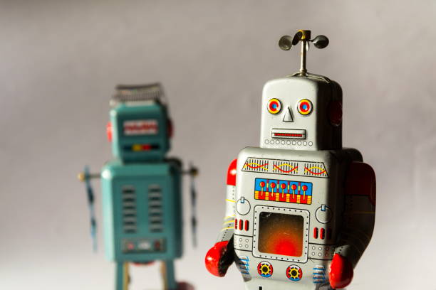istock Two vintage tin toy robots, robotic delivery, artificial intelligence concept 1011408304
