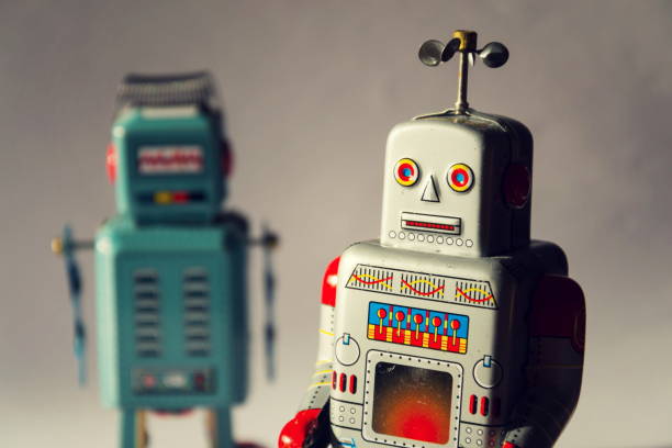 istock Two vintage tin toy robots, robotic delivery, artificial intelligence concept 1011408438