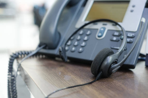 istock close up soft focus on telephone devices at office desk for customer service support concept 1011408812