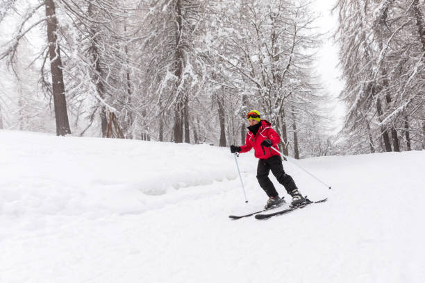 istock Skiing in winter - A guy having fun in winter 1011414958