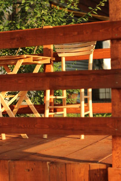 istock Outdoors Cafe wooden chairs 1011416496