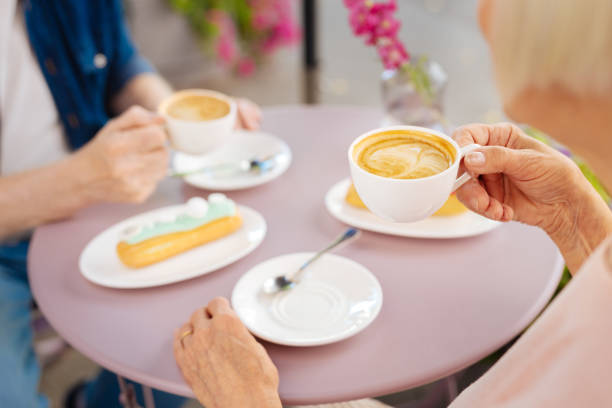 istock Pleasant mature hand rising coffee 1011418660