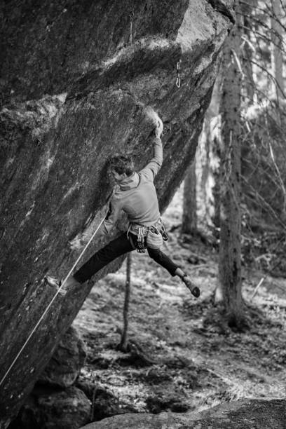 istock Active lifestyle concept.Young climber man climbing a rock. 1011426112