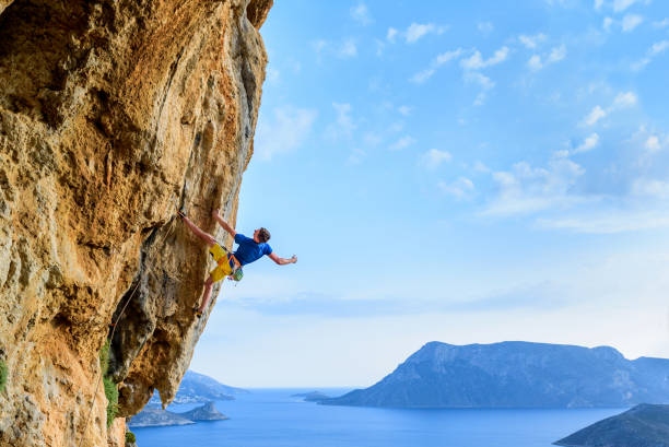 istock Rock climber on a challenging cliff, extreme sport lifestyle. Travelling Greece 1011433528