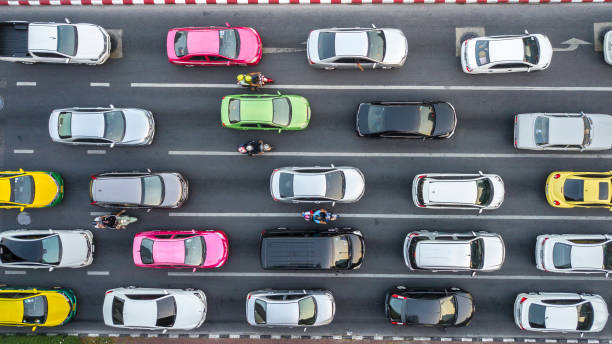 Traffic Jam on multilane road. Aerial drone photograph of traffic jam in metropolis city with lots of cars qued on lanes. rush hour photos stock pictures, royalty-free photos & images