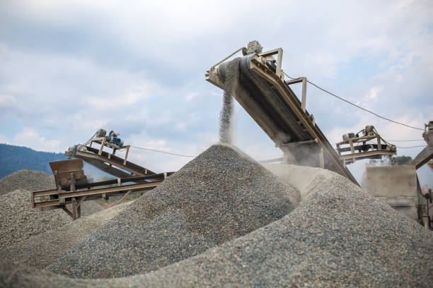 Heavy machinery at the quarry. Image of heavy machinery works at the quarry. sand mine stock pictures, royalty-free photos & images