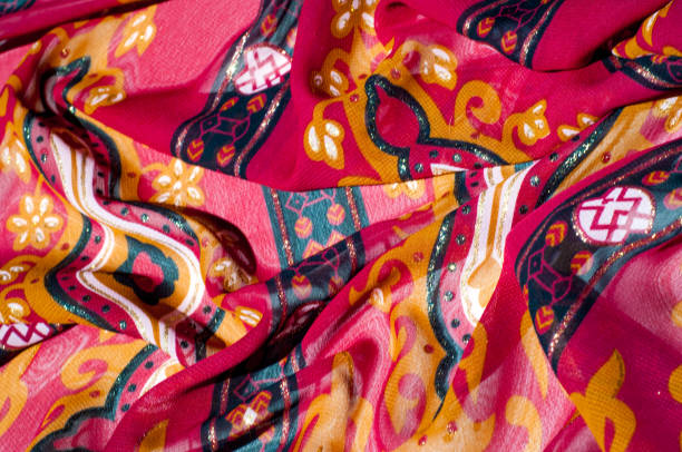 istock Background texture, pattern. Red maroon fabric. Click on your local heritage with this red, bard and yellow striped silk. This patterned fabric will decorate your design. your work will be exclusive 1011450936