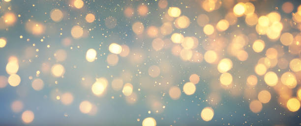 istock Christmas light background.  Holiday glowing backdrop. Defocused Background With Blinking Stars. Blurred Bokeh. 1011451892