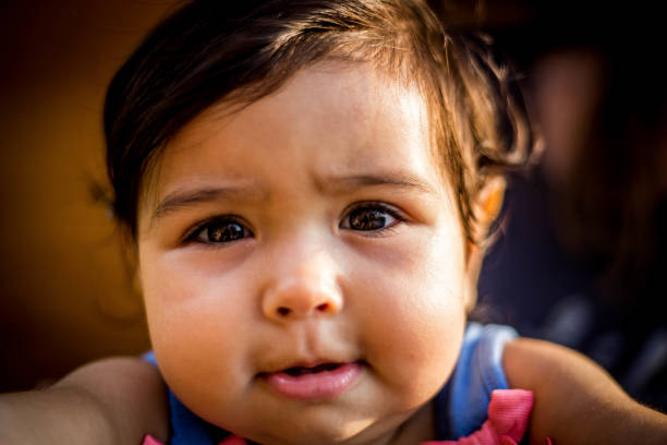 istock the baby looks in the camera 1011455380