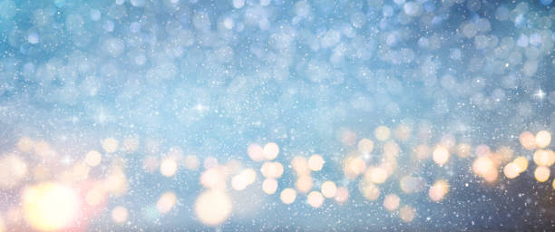 istock Christmas light background.  Holiday glowing backdrop. Defocused Background With Blinking Stars. Blurred Bokeh. 1011461056