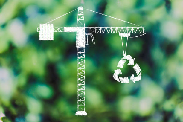 istock tower crane lifting up a recycle symbol, 1011461892