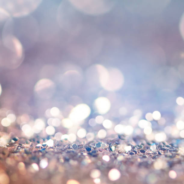 istock Christmas light background.  Holiday glowing backdrop. Defocused Background With Blinking Stars. Blurred Bokeh. 1011462320