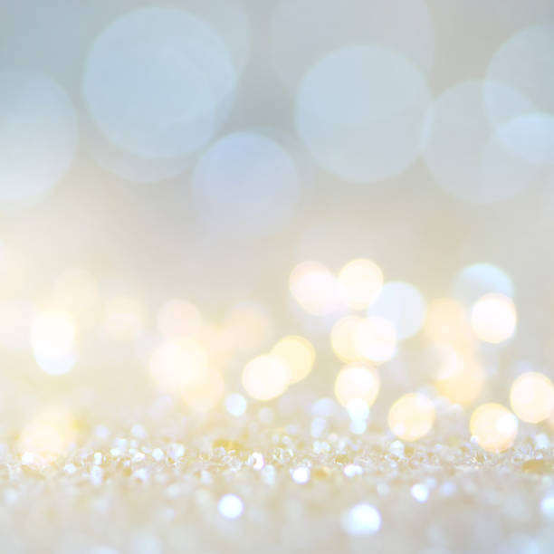 istock Christmas light background.  Holiday glowing backdrop. Defocused Background With Blinking Stars. Blurred Bokeh. 1011462342
