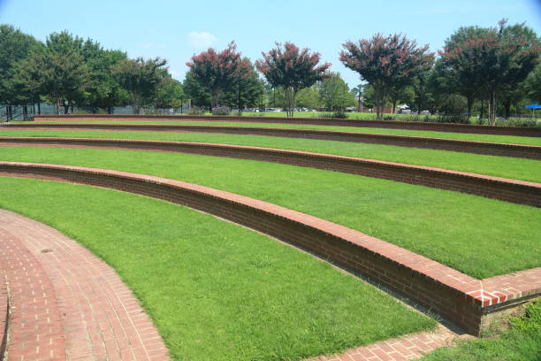 Amphitheater in local park Amphitheater Grass steps in local park amphitheater stock pictures, royalty-free photos & images