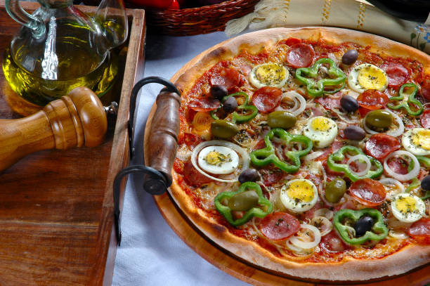 istock Portuguese Pizza, onion, peppers, pepperoni, egg, olive 1011476572
