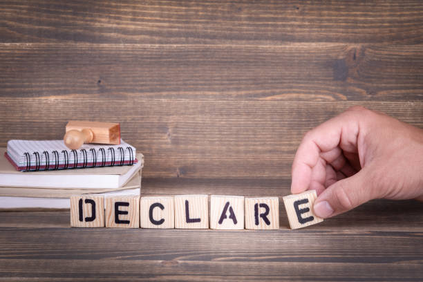 istock declare. wooden letters on the office desk 1011476978