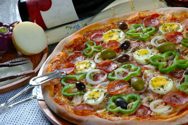 istock Portuguese Pizza, onion, peppers, pepperoni, egg, olive 1011477214