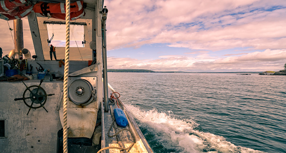 Lobster boat cruising among the islands near Stonington, Maine.