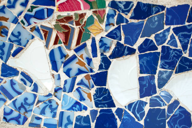 istock Mosaic in the park Guell in Barcelona, Spain. Ceramic puzzles, texture, background 1011486548
