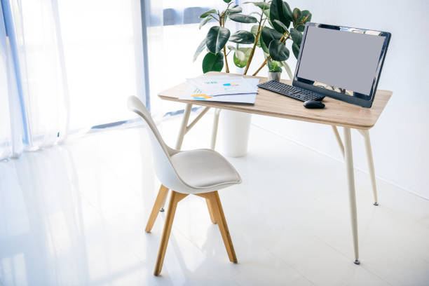 istock interior of room with chair, table, potted plant, infographics, computer, computer mouse and computer keyboard 1011489326