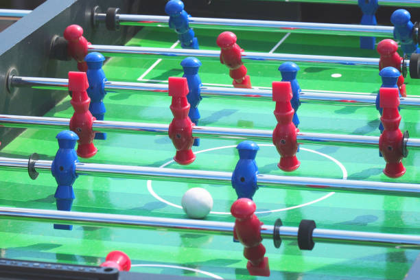 istock People play kicker table football soccer 1011489770