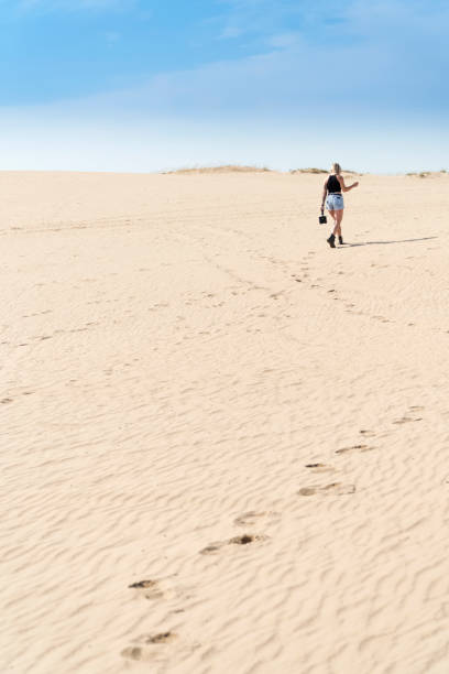 istock Woman going into the distance 1011493442