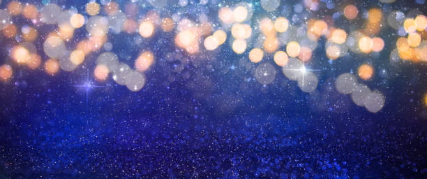 istock Christmas light background.  Holiday glowing backdrop. Defocused Background With Blinking Stars. Blurred Bokeh. 1011493506