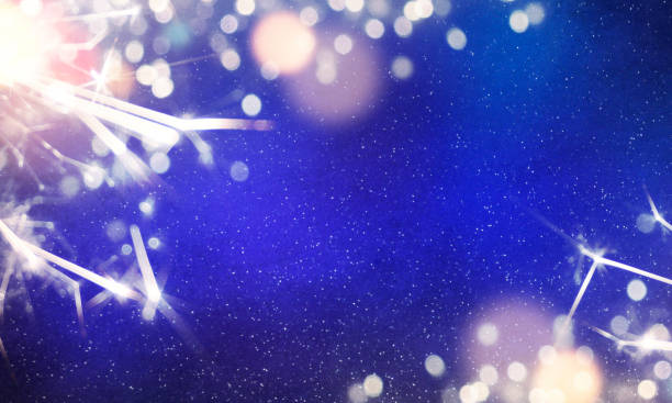 istock Christmas light background.  Holiday glowing backdrop. Defocused Background With Blinking Stars. Blurred Bokeh. 1011494314