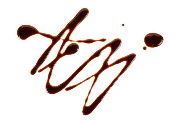istock Sweet chocolate sauce isolated on a white background 1011498756