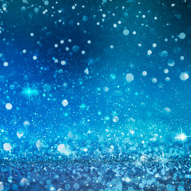 istock Christmas light background.  Holiday glowing backdrop. Defocused Background With Blinking Stars. Blurred Bokeh. 1011501494