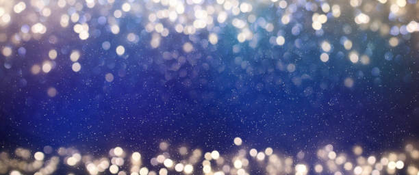 istock Christmas light background.  Holiday glowing backdrop. Defocused Background With Blinking Stars. Blurred Bokeh. 1011502482